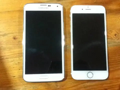 Samsung and Apple smartphones side by side for comparison