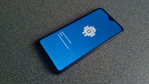 Samsung Galaxy phone installing a system update at 65 percent