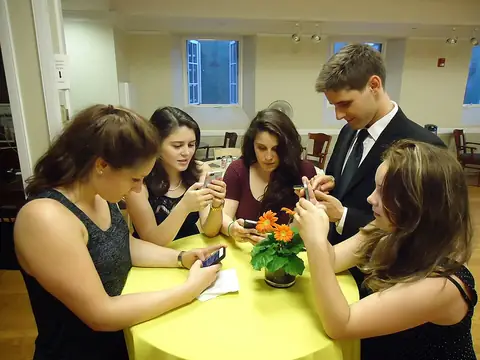 Young people typing on their smartphones with their thumbs